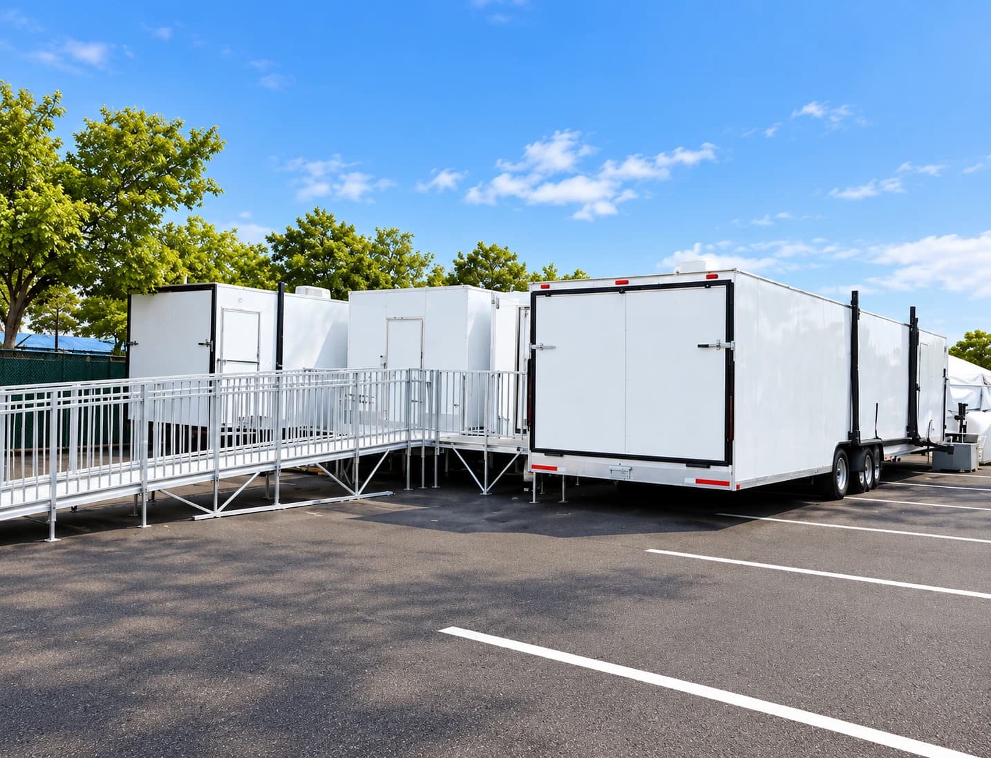 Access ramp and handrails alongside temporary facilities